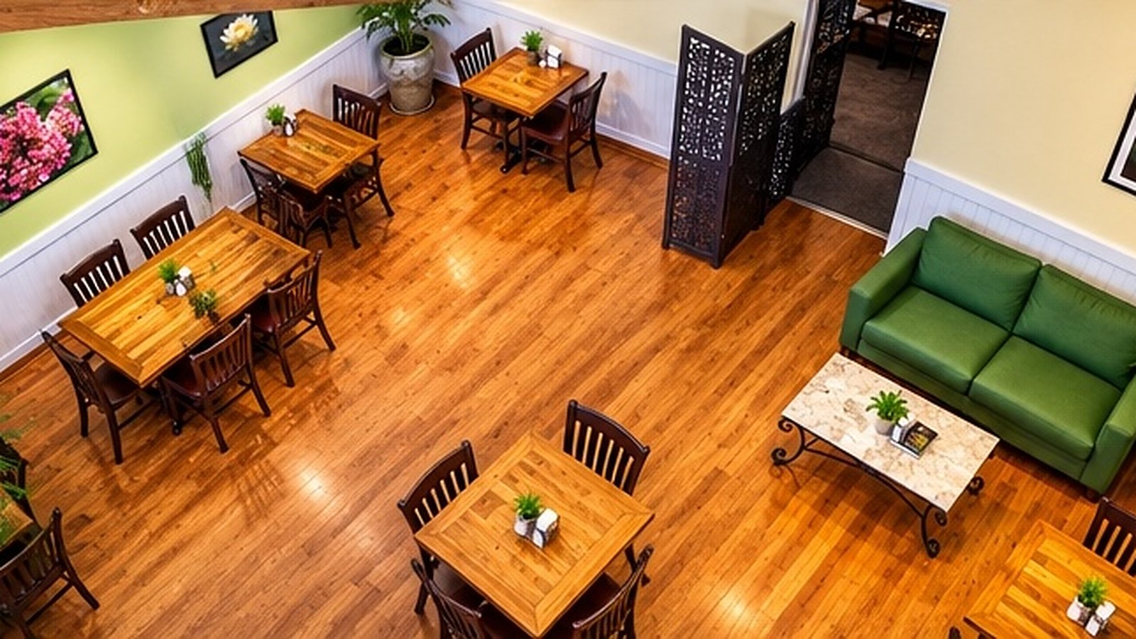 Crepas Café dining room with wood tables and green seating